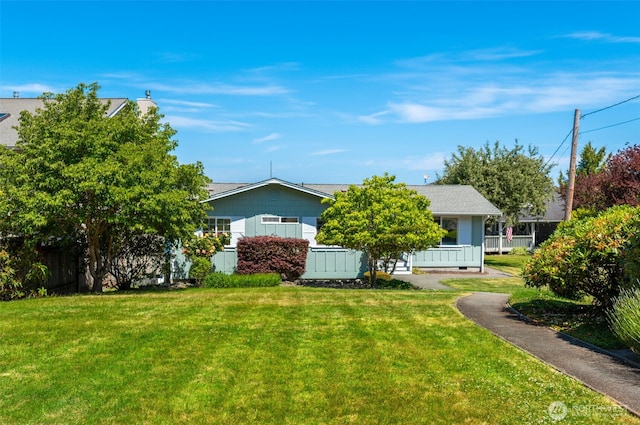 9340 SE Cornell Rd, Port Orchard, WA 98366 - view of property hidden behind natural elements featuring a front lawn
