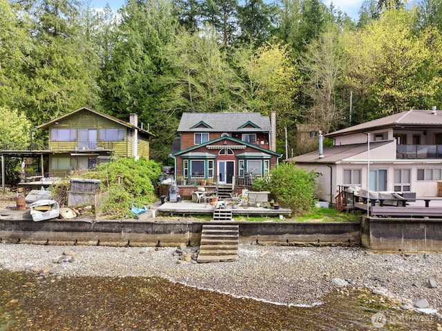 80 E Rose Point Ln, Belfair, WA 98528 - back of property featuring a wooden deck