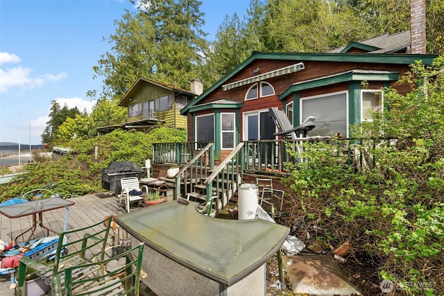 80 E Rose Point Ln, Belfair, WA 98528 - back of property with a wooden deck