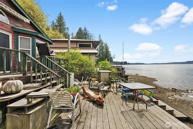 80 E Rose Point Ln, Belfair, WA 98528 - wooden deck featuring a water view, stairway, and outdoor dining area