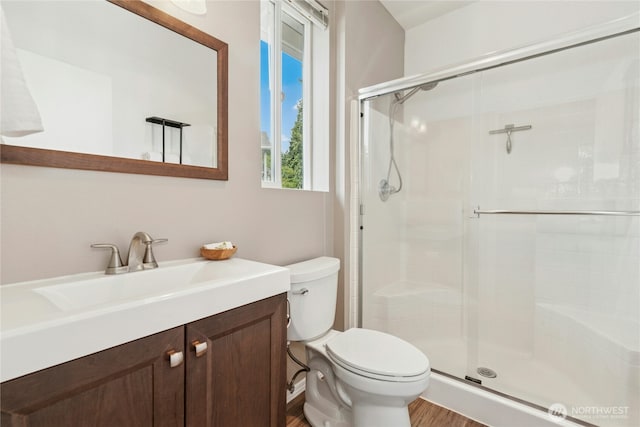 3006 SE 8th St Unit 2120, Renton, WA 98058 - full bathroom with a shower stall, vanity, and wood finished floors