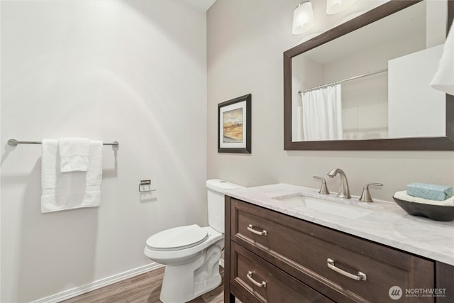 3006 SE 8th St Unit 2120, Renton, WA 98058 - bathroom with vanity, wood finished floors, and a shower with shower curtain
