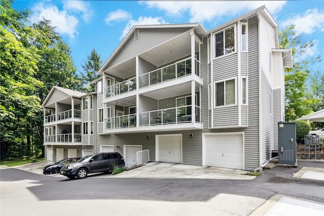 3006 SE 8th St Unit 2120, Renton, WA 98058 - view of front of house with an attached garage and driveway