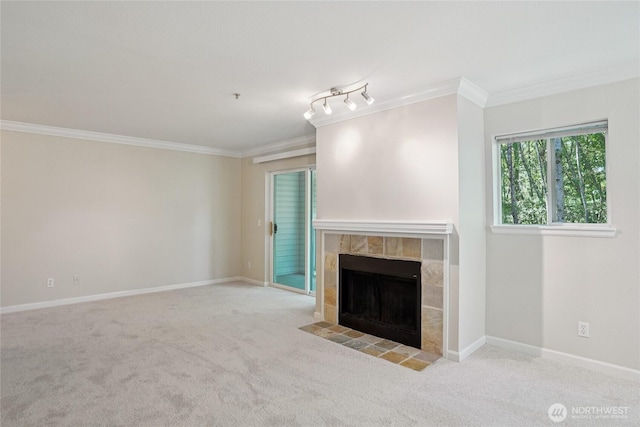 33020 10th Ave SW Unit E204, Federal Way, WA 98023 - unfurnished living room with crown molding, a tile fireplace, and carpet floors