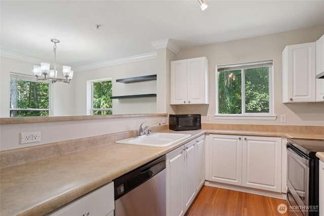 33020 10th Ave SW Unit E204, Federal Way, WA 98023 - kitchen featuring appliances with stainless steel finishes, white cabinets, a chandelier, decorative light fixtures, and ornamental molding
