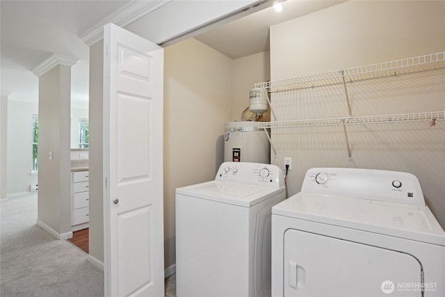 33020 10th Ave SW Unit E204, Federal Way, WA 98023 - laundry area featuring separate washer and dryer, carpet flooring, and secured water heater