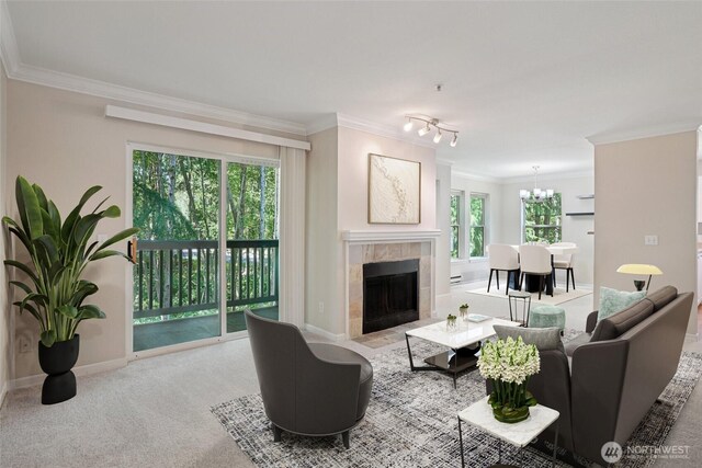 33020 10th Ave SW Unit E204, Federal Way, WA 98023 - carpeted living area featuring a chandelier, a fireplace, and ornamental molding