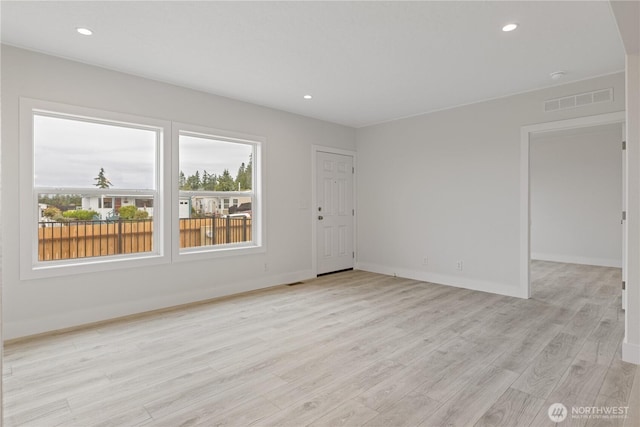 2204 Dublin Pl, Anacortes, WA 98221 - unfurnished room with light wood-style floors and recessed lighting