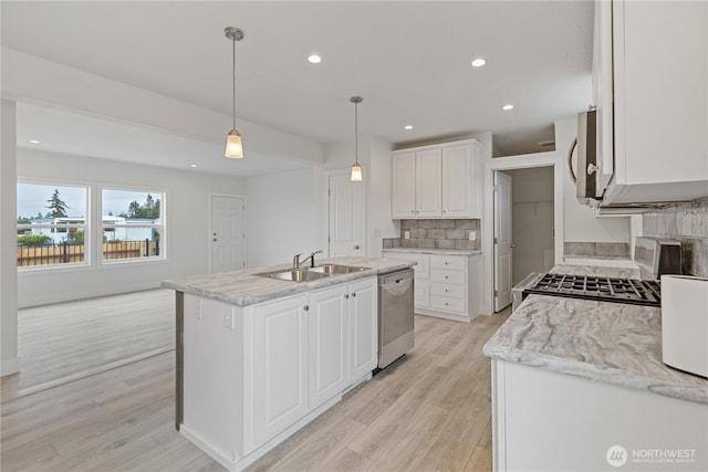 2204 Dublin Pl, Anacortes, WA 98221 - kitchen featuring stainless steel appliances, decorative backsplash, light wood-style floors, white cabinets, and recessed lighting