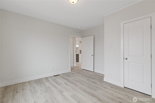 2204 Dublin Pl, Anacortes, WA 98221 - unfurnished bedroom featuring light wood-type flooring and baseboards