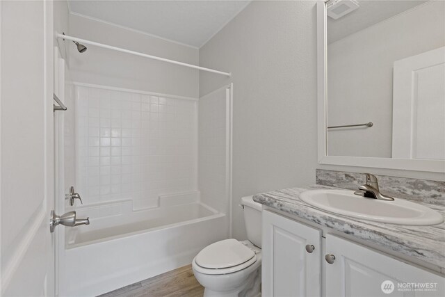 2204 Dublin Pl, Anacortes, WA 98221 - full bathroom with vanity, bathing tub / shower combination, and wood finished floors