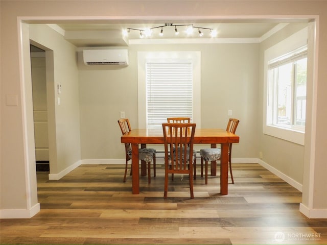 14806 131st Ave SE, Renton, WA 98058 - dining space featuring an AC wall unit, light wood finished floors, and track lighting