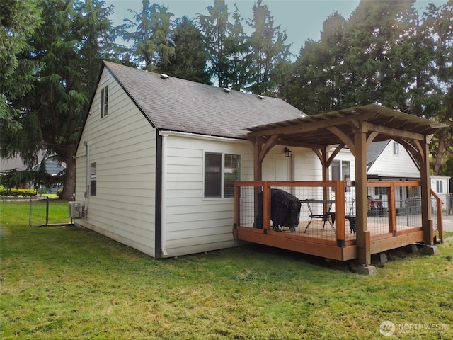 14806 131st Ave SE, Renton, WA 98058 - back of property with a wooden deck, roof with shingles, a pergola, and a yard