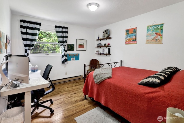 2815 Willis St, Bellingham, WA 98225 - bedroom featuring a baseboard radiator, wood-type flooring, and a desk
