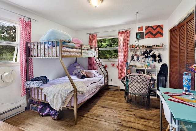 2815 Willis St, Bellingham, WA 98225 - bedroom with a baseboard radiator, hardwood / wood-style flooring, and a closet
