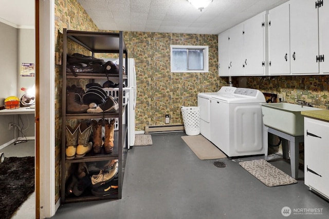 2815 Willis St, Bellingham, WA 98225 - washroom featuring cabinet space, washing machine and dryer, and a baseboard radiator
