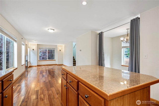 10736 Whitman Ave N, Seattle, WA 98133 - kitchen with tile countertops, brown cabinetry, dark wood finished floors, and a chandelier
