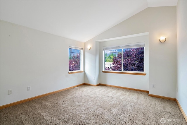10736 Whitman Ave N, Seattle, WA 98133 - unfurnished room featuring vaulted ceiling and carpet floors