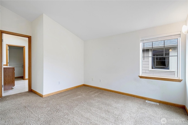 10736 Whitman Ave N, Seattle, WA 98133 - carpeted spare room with baseboards