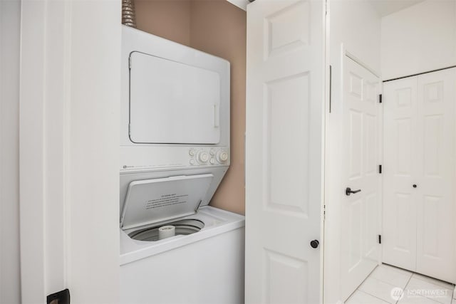 122 S State St Unit 207E, Kirkland, WA 98033 - laundry room with stacked washer / drying machine and light tile patterned flooring