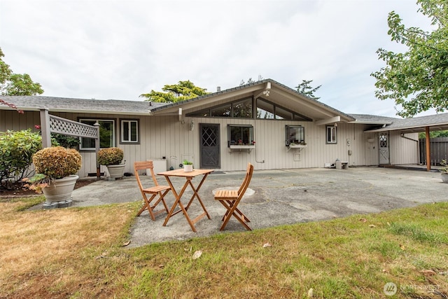 2130 W 4th, Port Angeles, WA 98363 - back of house with a patio area, a yard, and roof with shingles