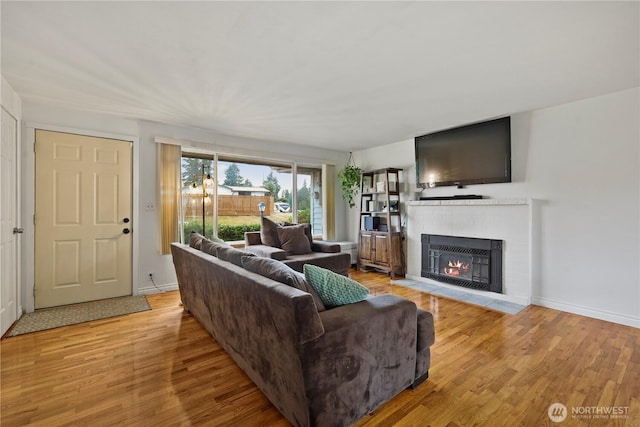 1220 S 313th St, Federal Way, WA 98003 - living room with light wood-style floors and a fireplace