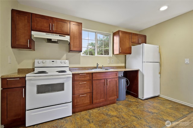 1220 S 313th St, Federal Way, WA 98003 - kitchen featuring white appliances, under cabinet range hood, recessed lighting, light countertops, and dark stone finish floors