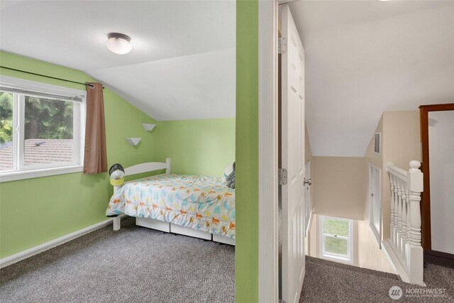 825 Main St, Lynden, WA 98267 - bedroom featuring vaulted ceiling, carpet, and multiple windows
