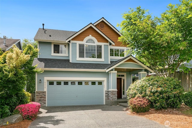 18328 10th Dr SE, Bothell, WA 98012 - craftsman-style home featuring stone siding, an attached garage, asphalt driveway, and a shingled roof