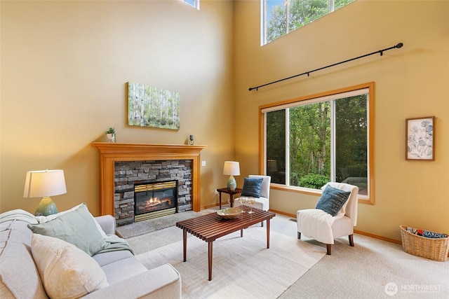 18328 10th Dr SE, Bothell, WA 98012 - living area with carpet floors, plenty of natural light, a fireplace, and a towering ceiling