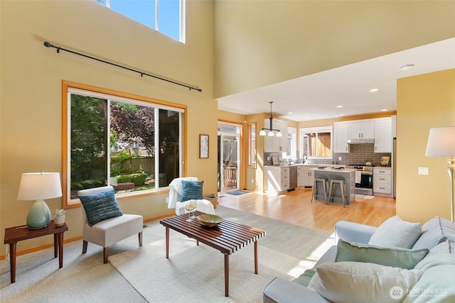 18328 10th Dr SE, Bothell, WA 98012 - living room with recessed lighting, light wood-type flooring, and a high ceiling