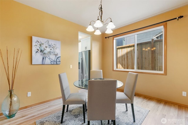18328 10th Dr SE, Bothell, WA 98012 - dining space with light wood finished floors and a chandelier