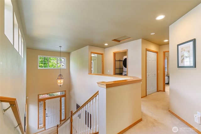 18328 10th Dr SE, Bothell, WA 98012 - corridor featuring an upstairs landing, recessed lighting, light carpet, attic access, and estacked washer and dryer