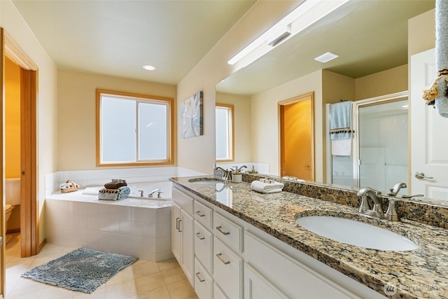 18328 10th Dr SE, Bothell, WA 98012 - bathroom with double vanity, a shower stall, a garden tub, and tile patterned flooring