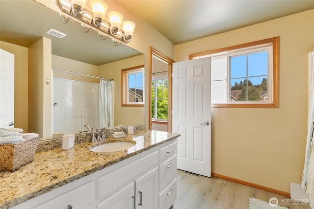 18328 10th Dr SE, Bothell, WA 98012 - full bathroom with wood finished floors, vanity, and a shower with curtain