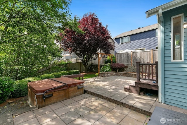 18328 10th Dr SE, Bothell, WA 98012 - fenced backyard featuring a hot tub and a patio