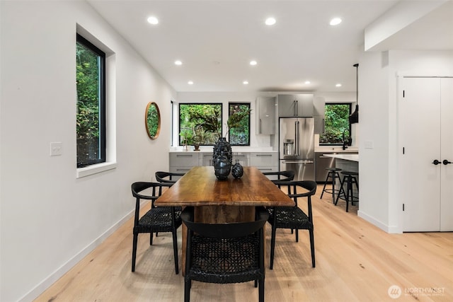 5606 23rd Ave SW, Seattle, WA 98106 - dining room featuring recessed lighting and light wood-style floors