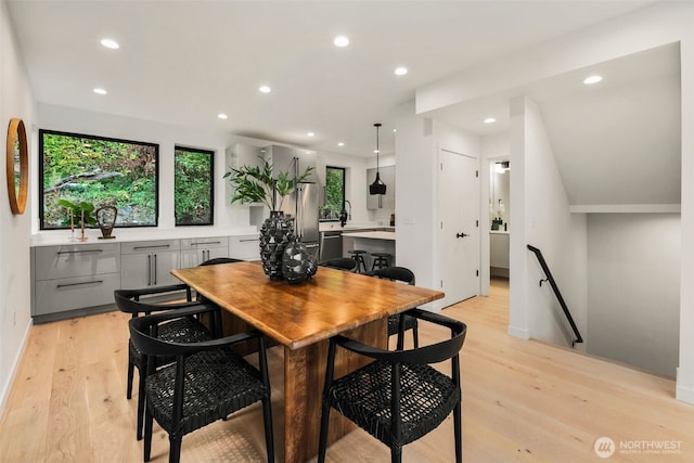 5606 23rd Ave SW, Seattle, WA 98106 - dining room with light wood-style floors and recessed lighting