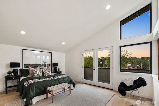 5606 23rd Ave SW, Seattle, WA 98106 - bedroom with access to exterior, wood finished floors, french doors, vaulted ceiling, and recessed lighting