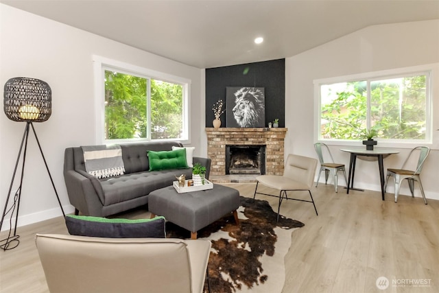 21241 S 29th Ave, Seatac, WA 98198 - living area featuring light wood-style floors, vaulted ceiling, a fireplace, and recessed lighting