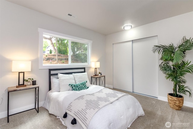 21241 S 29th Ave, Seatac, WA 98198 - carpeted bedroom featuring a closet and baseboards