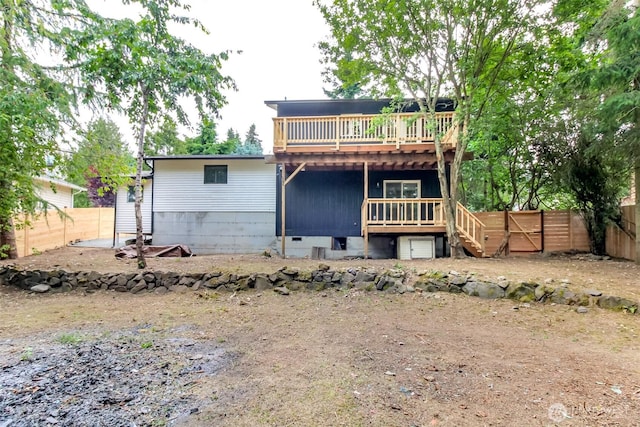 21241 S 29th Ave, Seatac, WA 98198 - rear view of house featuring a wooden deck and a fenced backyard
