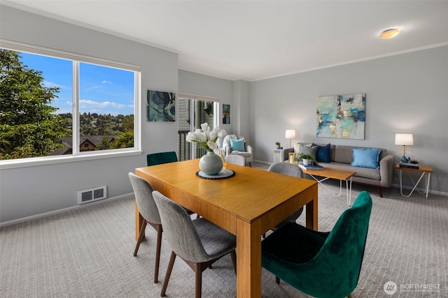 1812 25th Ave Unit C, Seattle, WA 98122 - dining area featuring carpet flooring and ornamental molding