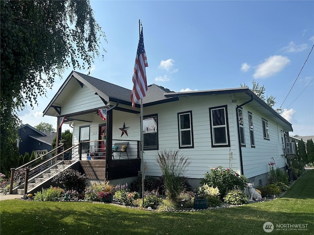 242 Morton St, Sumas, WA 98295 - view of front of house with covered porch, a front lawn, and stairway