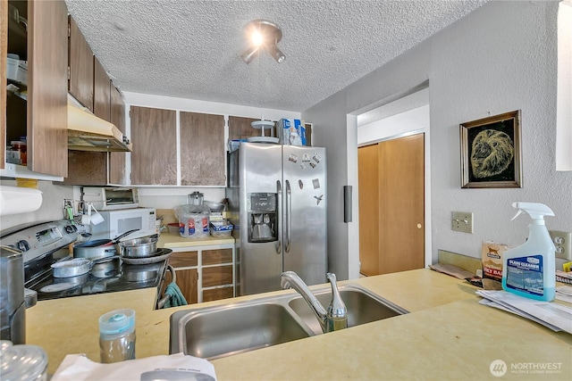 1823 M St NE Unit 1823, Auburn, WA 98002 - kitchen featuring stainless steel refrigerator with ice dispenser, light countertops, a textured ceiling, electric stove, and under cabinet range hood