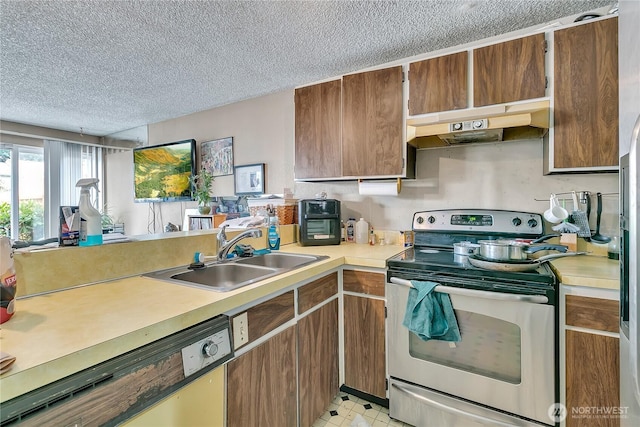 1823 M St NE Unit 1823, Auburn, WA 98002 - kitchen with stainless steel range with electric stovetop, under cabinet range hood, white dishwasher, a textured ceiling, and light countertops