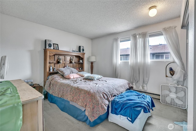 1823 M St NE Unit 1823, Auburn, WA 98002 - carpeted bedroom featuring a baseboard radiator and a textured ceiling