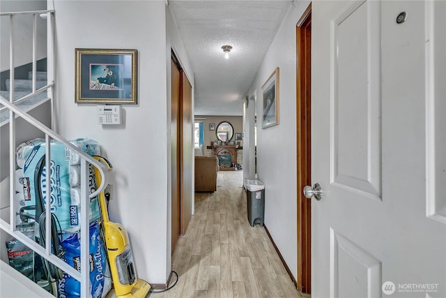 1823 M St NE Unit 1823, Auburn, WA 98002 - corridor featuring a textured ceiling and light wood finished floors
