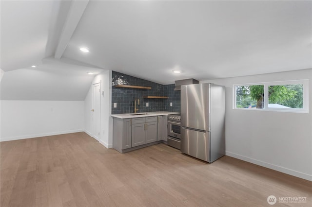 10303 40th Ave E, Tacoma, WA 98446 - kitchen with stainless steel appliances, gray cabinets, open shelves, light countertops, and light wood-style floors