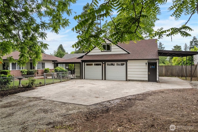 10303 40th Ave E, Tacoma, WA 98446 - garage with concrete driveway and a carport